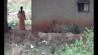 desi lady pissing behind her house 2