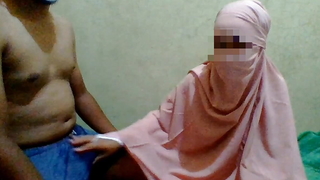 a explicit wearing a hijab does a handjob alongside her maid
