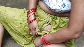 Indian abode wife bathing outside